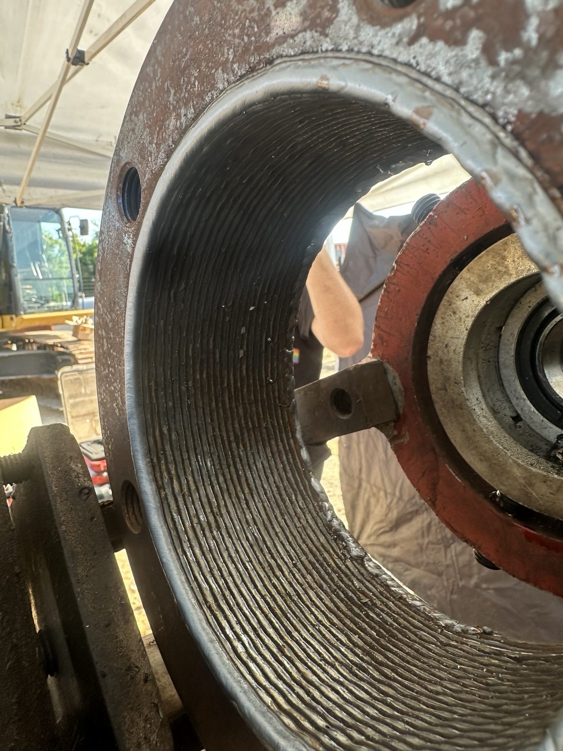 Close-up of repaired heavy equipment bore